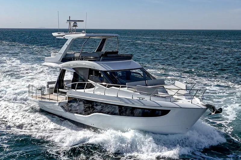 Slide: The Image of 2025 Galeon 500 Fly yacht cruising on open sea, showcasing sleek design and luxury features. - 1