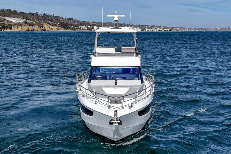 Slide: The Image of 2025 Galeon 500 Fly yacht cruising on open water, showcasing sleek design and luxury features. - 10