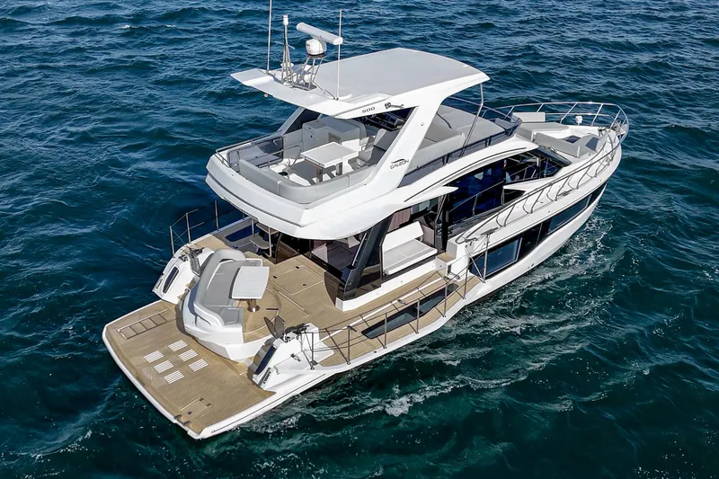 Slide: The Image of 2025 Galeon 500 Fly yacht cruising on open sea, showcasing luxury design and spacious deck. - 12