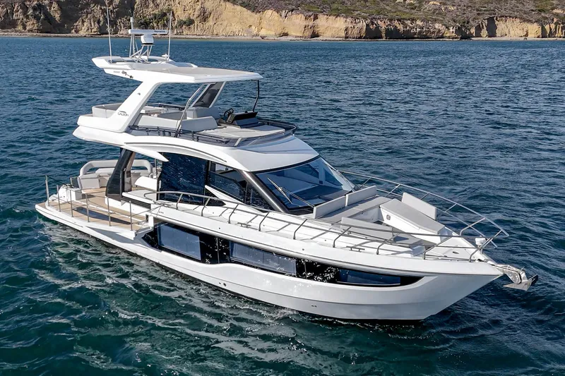 Slide: The Image of 2025 Galeon 500 Fly yacht cruising on open water, showcasing sleek design and luxury features. - 18