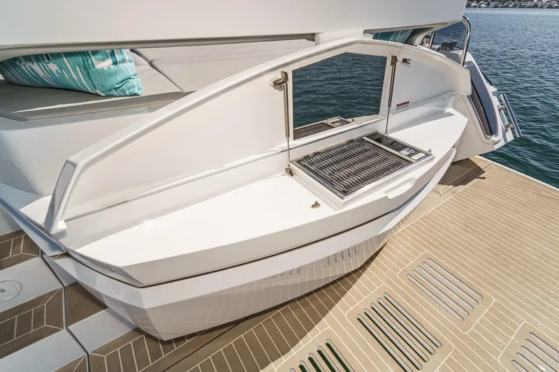 Slide: The Image of Luxury Galeon 500 Fly yacht deck with built-in grill, 2025 model. - 26