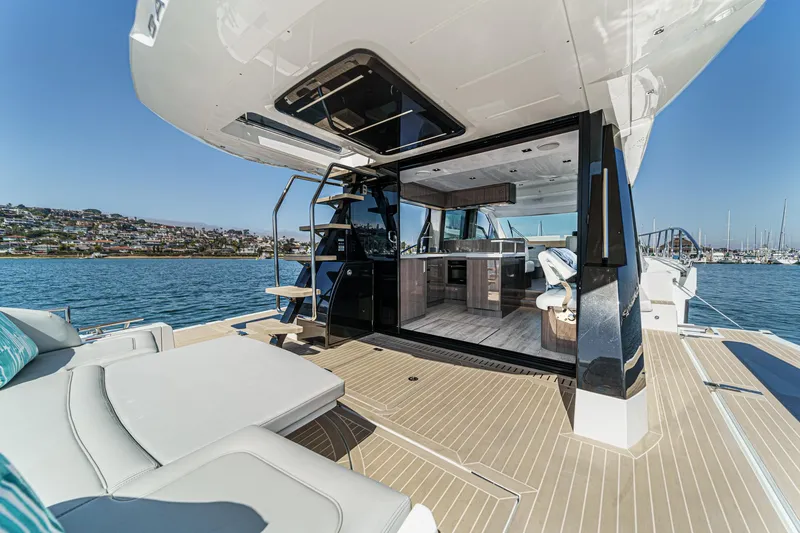 Slide: The Image of 2025 Galeon 500 Fly yacht with luxurious deck and interior on a sunny day. - 27