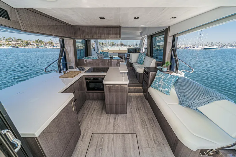 Slide: The Image of Luxurious interior of 2025 Galeon 500 Fly yacht with modern kitchen and seating area. - 31