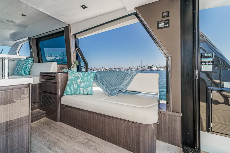 Slide: The Image of Interior of 2025 Galeon 500 Fly yacht with modern seating and ocean view. - 32