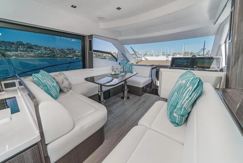 Slide: The Image of Luxurious interior of 2025 Galeon 500 Fly yacht with elegant seating and scenic views. - 37