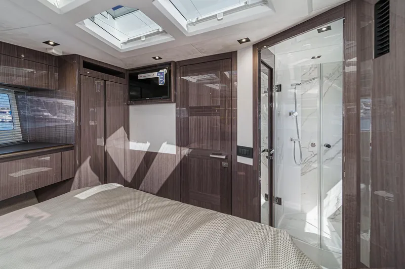 Slide: The Image of Luxurious interior of 2025 Galeon 500 Fly yacht with modern wood finishes and skylights. - 45