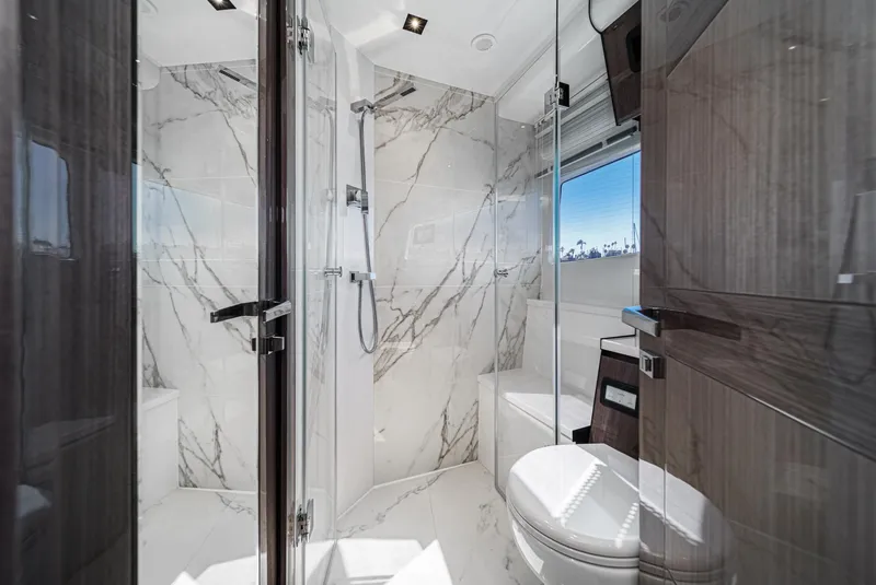Slide: The Image of Luxurious bathroom interior of 2025 Galeon 500 Fly yacht with marble accents. - 47