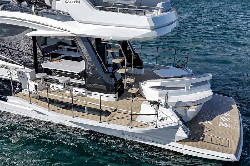 Slide: The Image of 2025 Galeon 500 Fly yacht on water, showcasing modern design and spacious deck. - 6