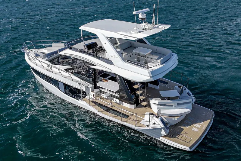 Slide: The Image of 2025 Galeon 500 Fly yacht cruising on open water, showcasing sleek design and spacious deck. - 7