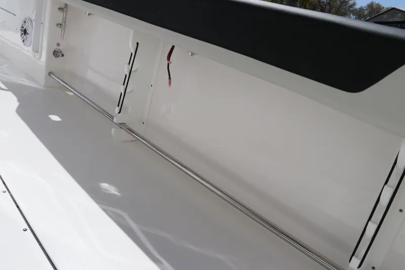 Slide: The Image of 2025 Edgewater 325CC boat seating with black and white upholstery. - 11
