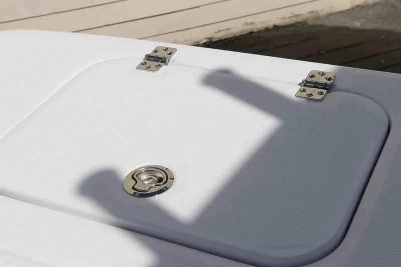 Slide: The Image of Edgewater 325CC 2025 boat interior with sleek white and black design. - 13