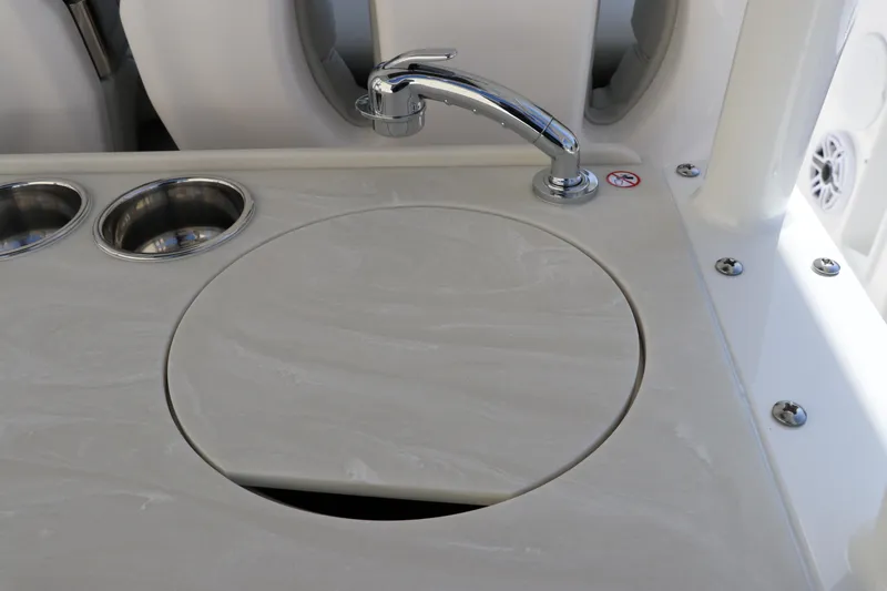 Slide: The Image of Open storage drawers on a 2025 Edgewater 325CC boat. - 17