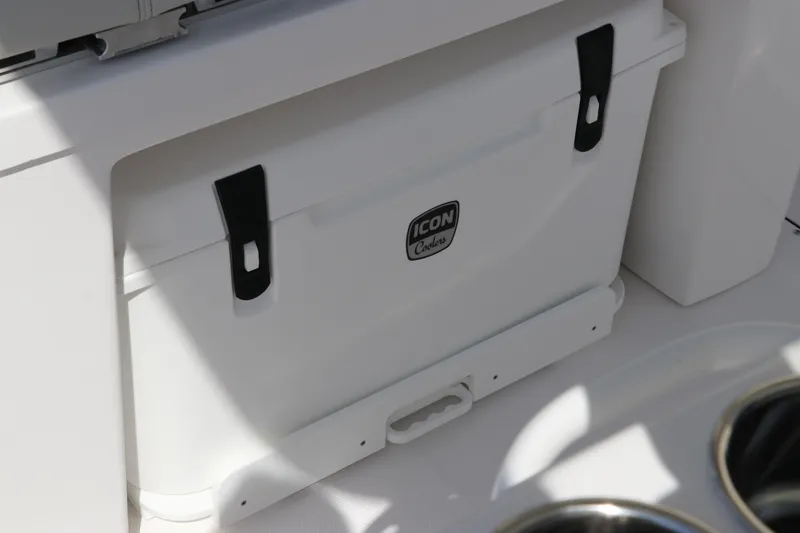 Slide: The Image of 2025 Edgewater 325CC boat interior ceiling with speaker and storage compartment. - 33