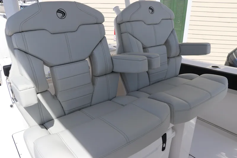 Slide: The Image of 2025 Edgewater 325CC boat with luxurious gray seating and modern design. - 35