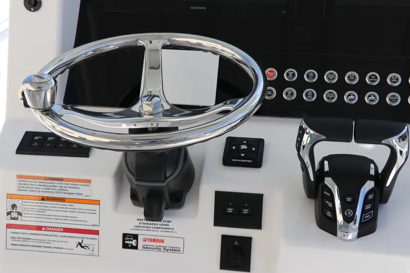 Slide: The Image of Edgewater 325CC 2025 boat console with storage compartment and cup holders. - 40