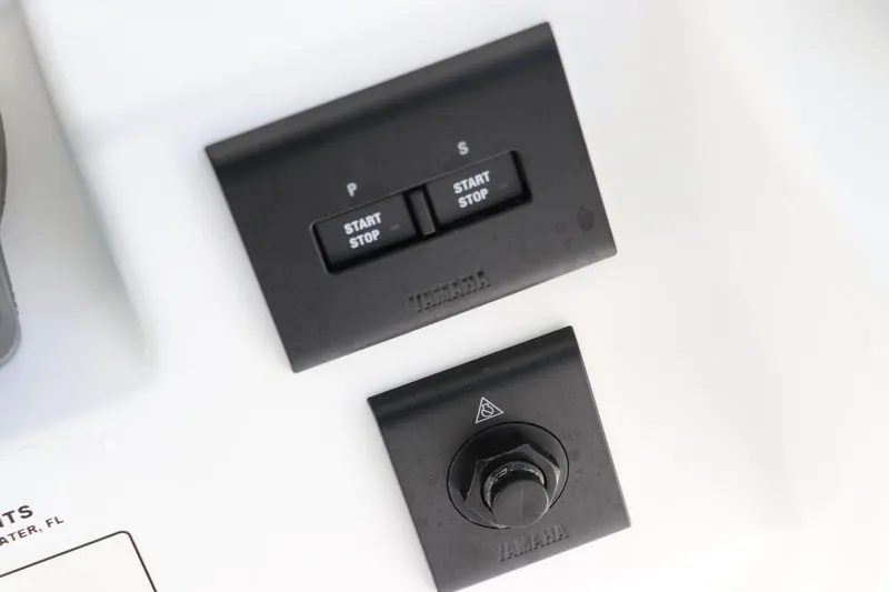 Slide: The Image of Control panel on 2025 Edgewater 325CC boat with navigation buttons. - 43