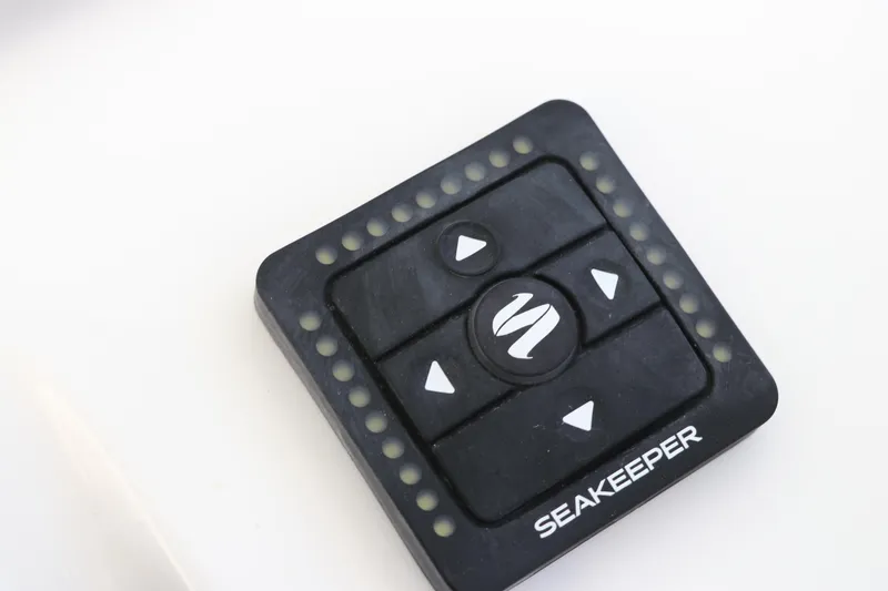 Slide: The Image of Control panel of 2025 Edgewater 325CC boat with start/stop buttons and knob. - 44