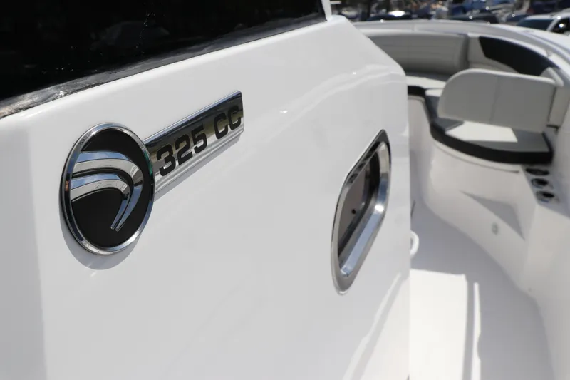 Slide: The Image of Edgewater 325CC 2025 boat dashboard with Garmin electronics and controls. - 47
