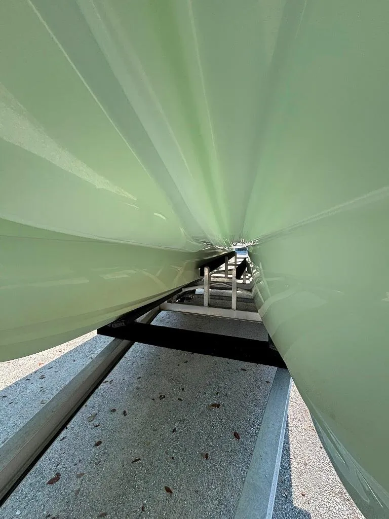 Slide: The Image of 2023 Prowler 25 boat hull on trailer, showcasing sleek design and structure. - 11