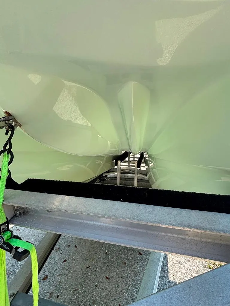 Slide: The Image of 2023 Prowler 25 boat hull on trailer, showing underside details. - 12