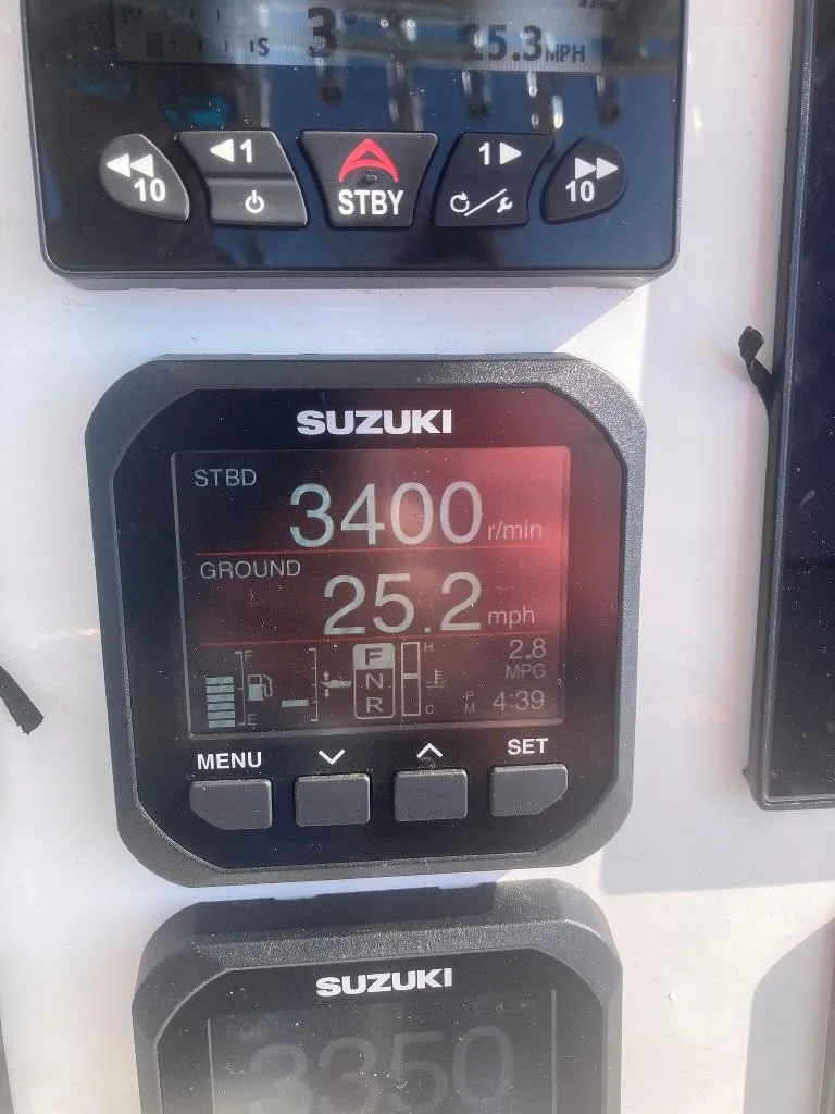 Slide: The Image of Suzuki boat display showing 3400 RPM and 25.2 mph speed on a 2023 Prowler 25. - 24
