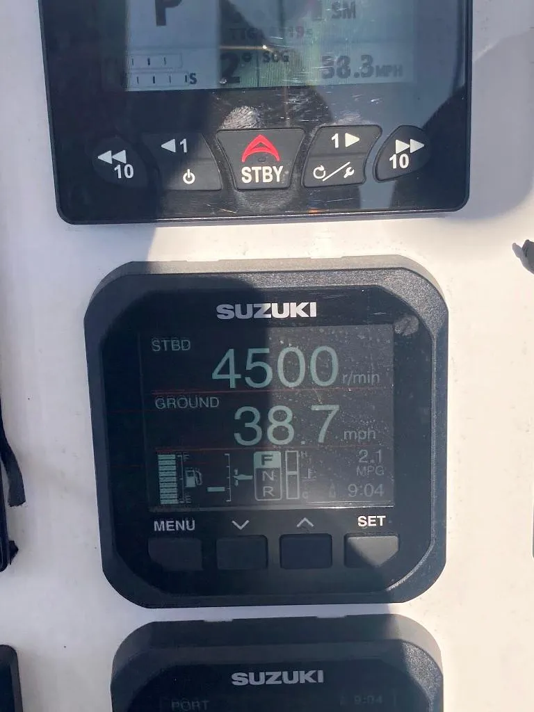 Slide: The Image of Suzuki boat dashboard display showing RPM and speed on a 2023 Prowler 25. - 25