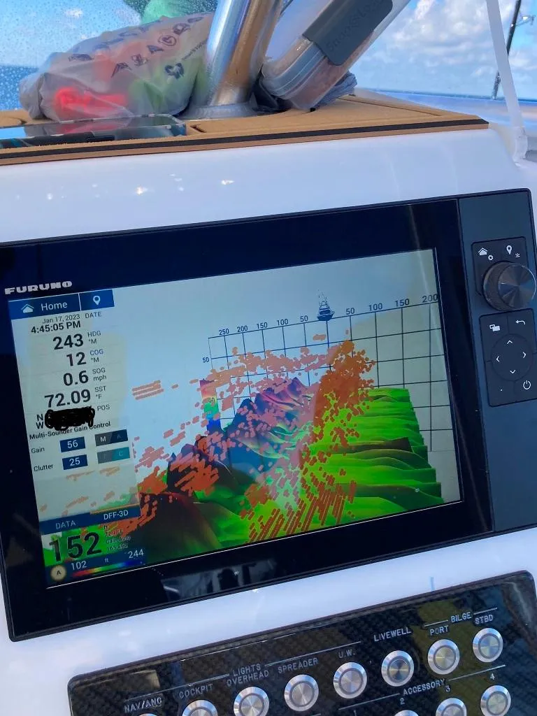 Slide: The Image of Fishfinder display on 2023 Prowler 25 boat, showing underwater topography and data. - 27