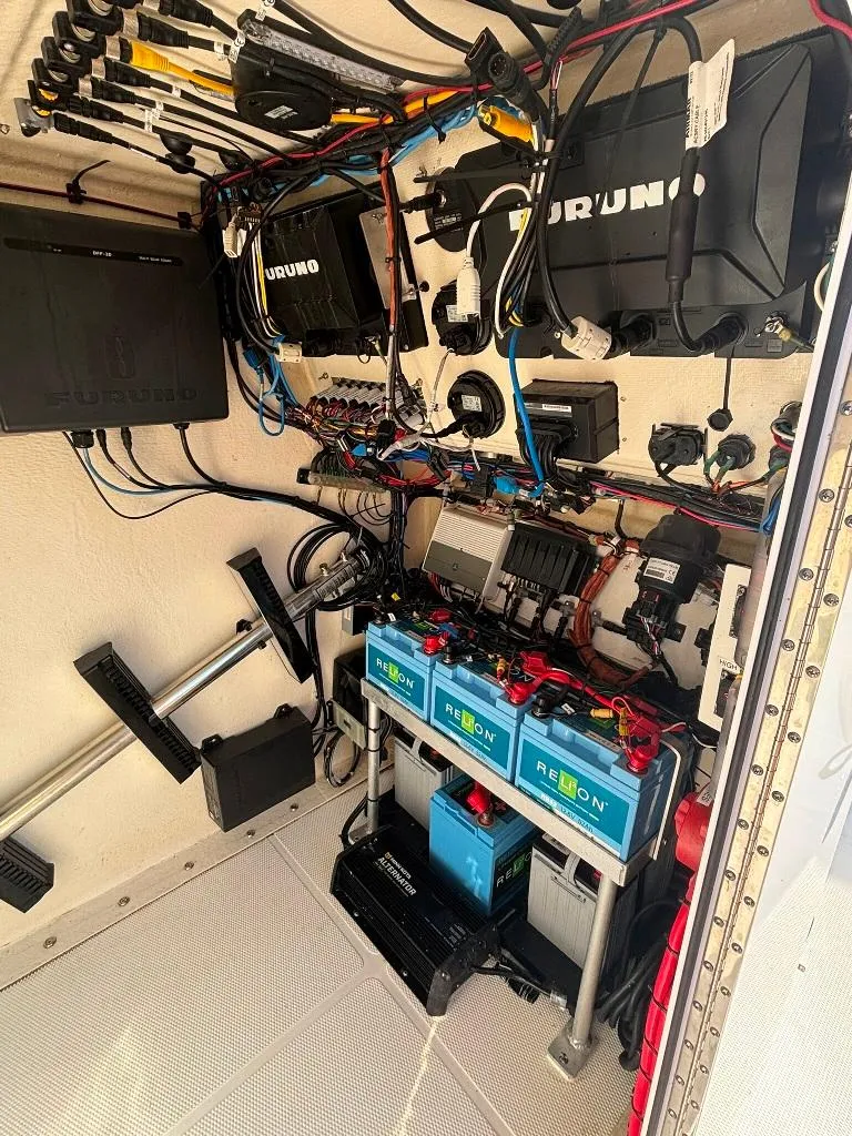 Slide: The Image of Electrical system setup in a 2023 Prowler 25, featuring batteries and wiring components. - 32
