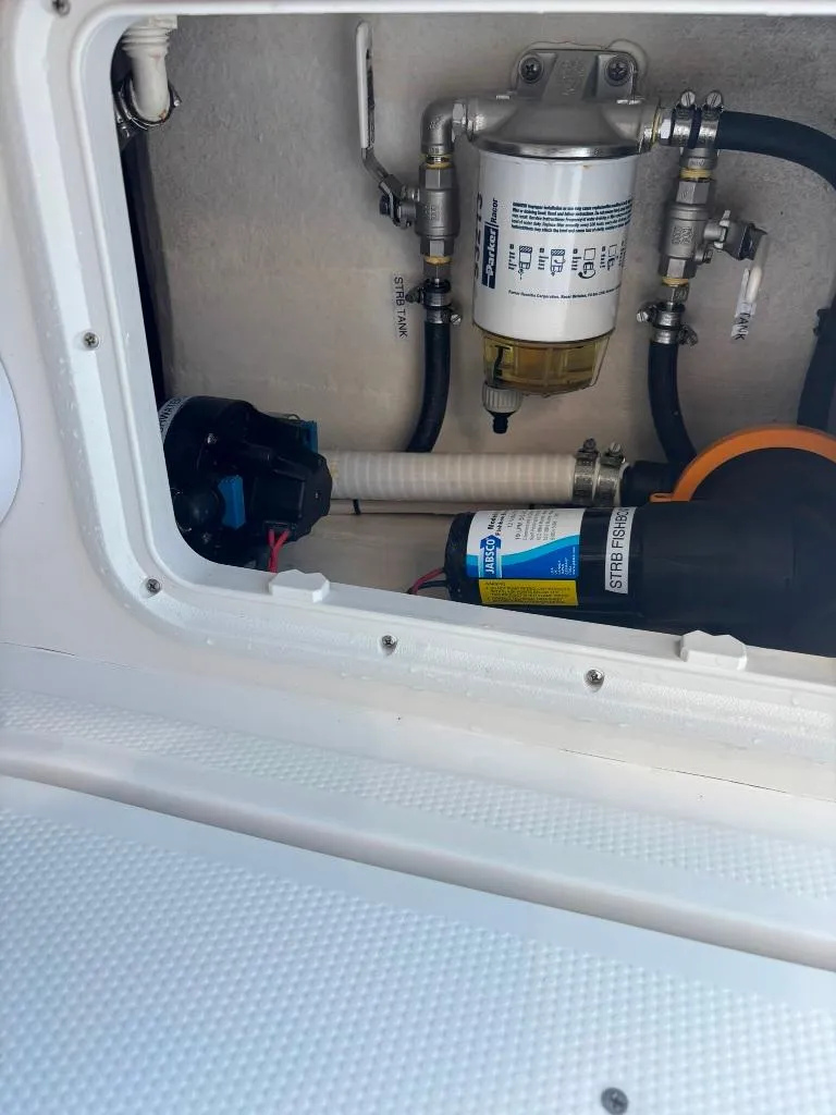 Slide: The Image of 2023 Prowler 25 engine compartment with fuel filter and hoses. - 38