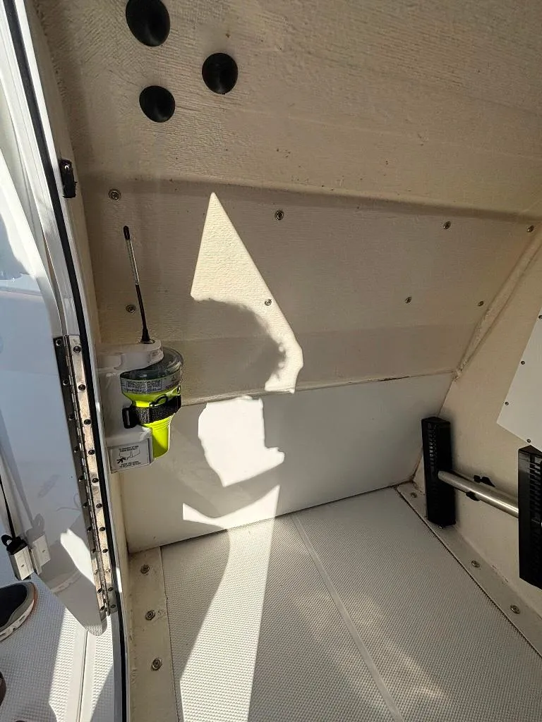 Slide: The Image of Interior view of 2023 Prowler 25 boat cabin with sunlight and equipment. - 47