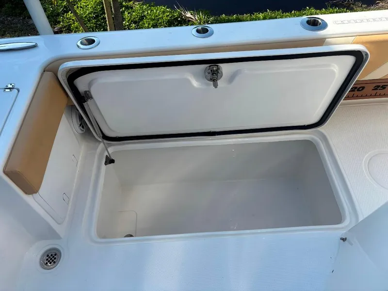 Slide: The Image of Open storage compartment on 2023 Prowler 25 boat, featuring a spacious interior. - 48