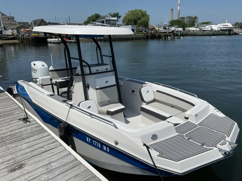 The Image of 2025 Starcraft SVX 211 OB CC boat docked by the waterfront. - 0