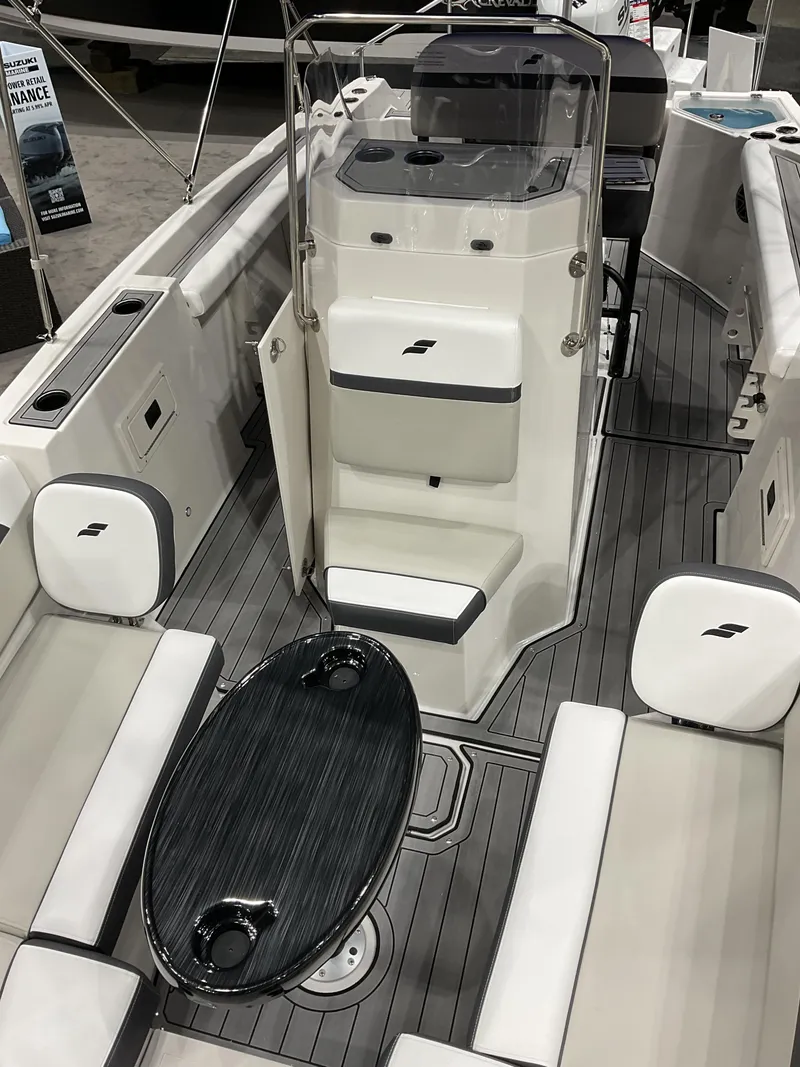 Slide: The Image of 2025 Starcraft SVX 211 OB CC boat interior with seating and console. - 16