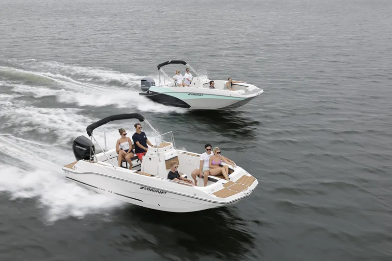 Slide: The Image of 2025 Starcraft SVX 211 OB CC boats cruising on open water. - 35