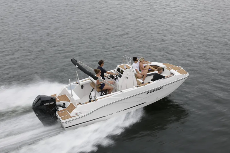 Slide: The Image of 2025 Starcraft SVX 211 OB CC boat cruising on water with passengers. - 42