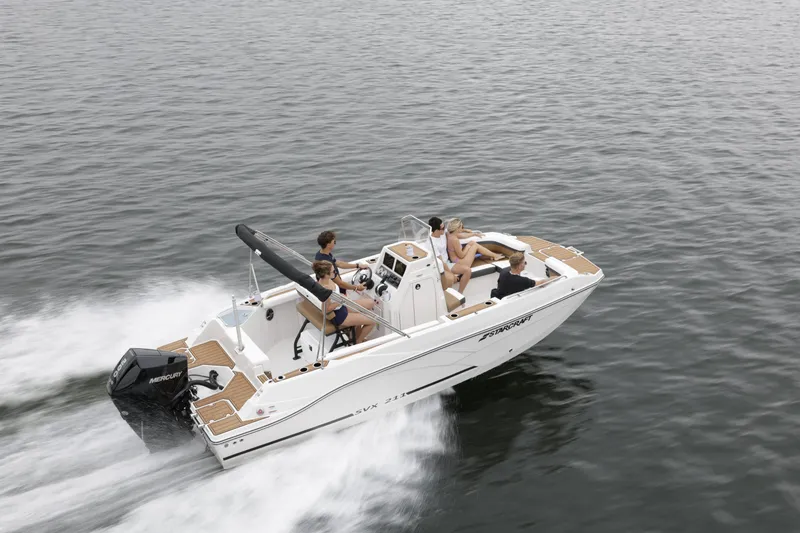 Slide: The Image of 2025 Starcraft SVX 211 OB CC boat cruising on open water with passengers. - 43