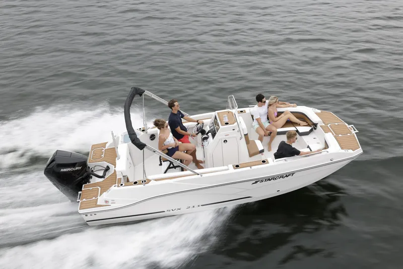 Slide: The Image of 2025 Starcraft SVX 211 OB CC boat cruising with passengers on open water. - 46