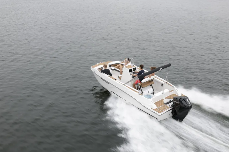 Slide: The Image of 2025 Starcraft SVX 211 OB CC boat cruising on open water. - 47