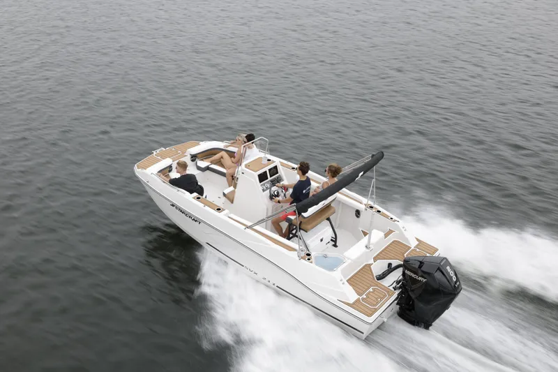 Slide: The Image of 2025 Starcraft SVX 211 OB CC boat cruising on open water with passengers. - 48