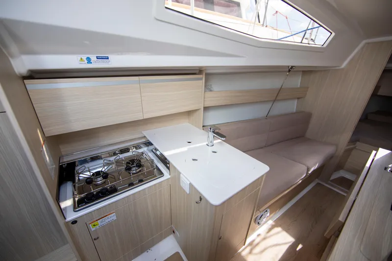 Slide: The Image of Interior of 2025 Maxus 26 yacht featuring modern kitchen and seating area. - 11