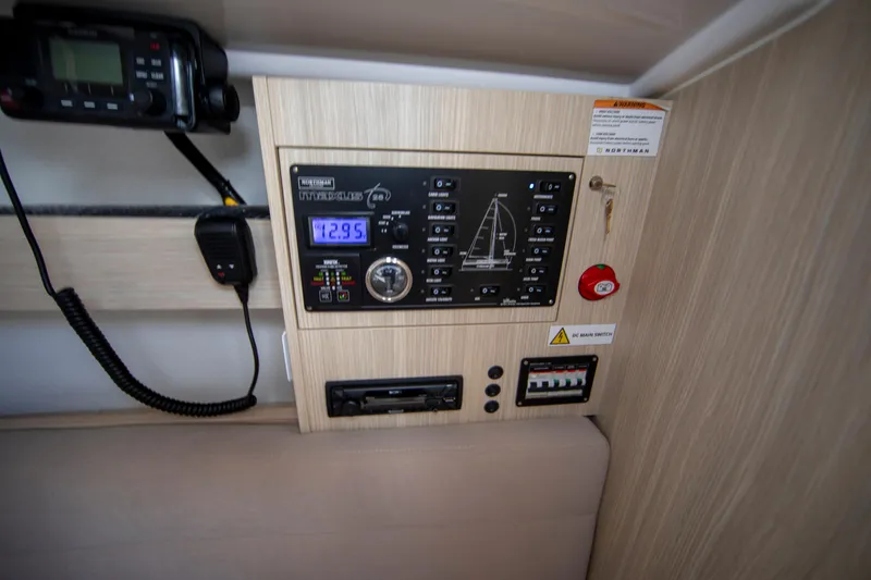 Slide: The Image of Control panel inside 2025 Maxus 26 boat, featuring navigation and communication equipment. - 13