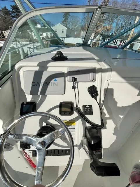 Slide: The Image of 2008 Sailfish 218 WAC boat dashboard with Garmin navigation and communication equipment. - 12
