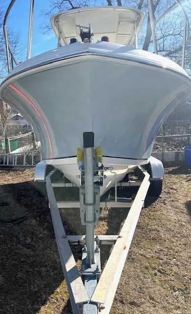 Slide: The Image of 2008 Sailfish 218 WAC boat on trailer, front view, outdoors. - 19