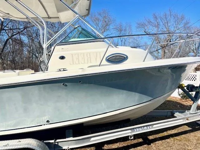 Slide: The Image of 2008 Sailfish 218 WAC boat on trailer, side view, outdoors. - 4