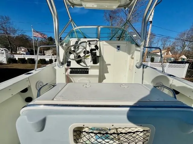 Slide: The Image of 2008 Sailfish 218 WAC boat interior with steering wheel and American flag in background. - 8