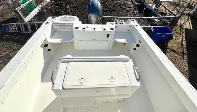 Slide: The Image of 2008 Sailfish 218 WAC boat interior with storage compartments and outboard motor. - 9