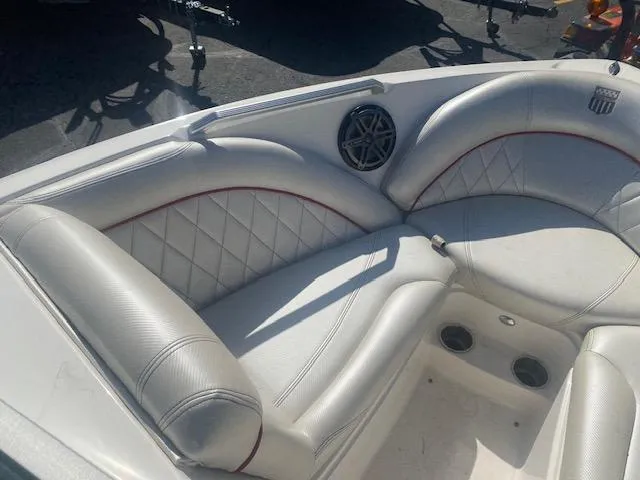 Slide: The Image of 2013 MasterCraft X-10 boat interior with white leather seating and speaker. - 10