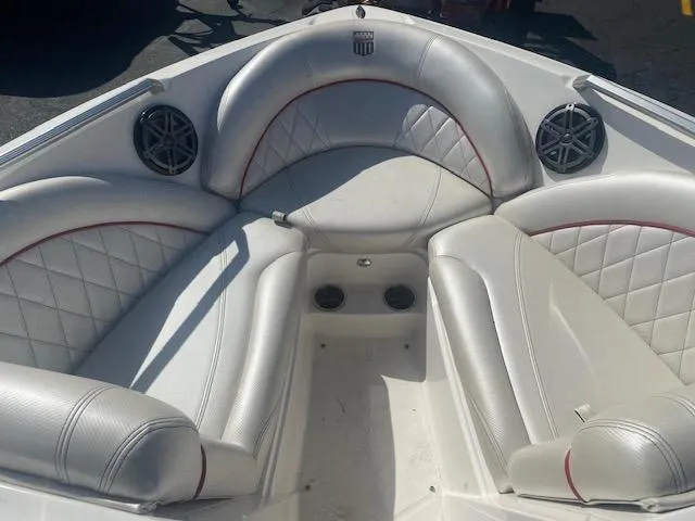 Slide: The Image of 2013 MasterCraft X-10 boat interior with white leather seating and built-in speakers. - 11