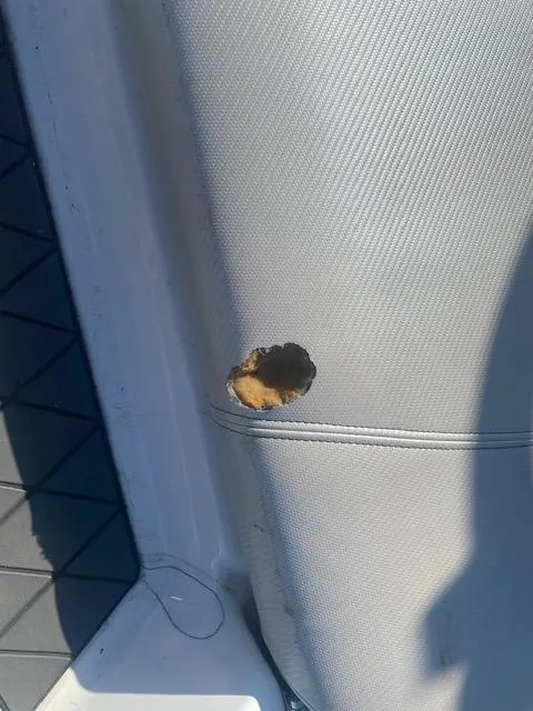 Slide: The Image of Damaged upholstery on 2013 MasterCraft X-10 boat seat. - 13