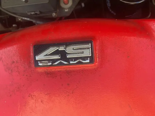 Slide: The Image of Red engine cover with "5.7L V8" emblem, MasterCraft X-10, 2013 model. - 3
